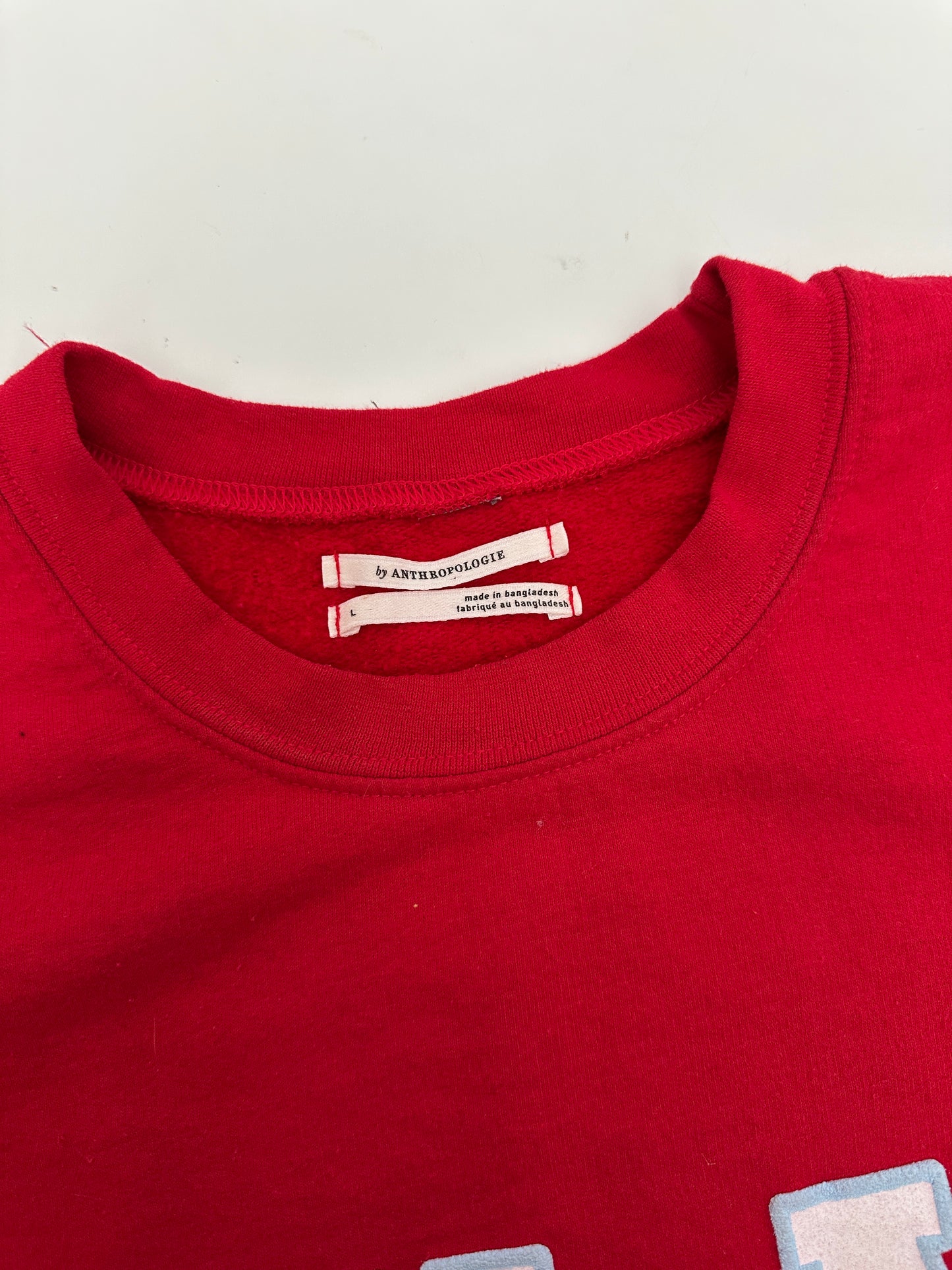Anthropologie red Milan crewneck (size large)