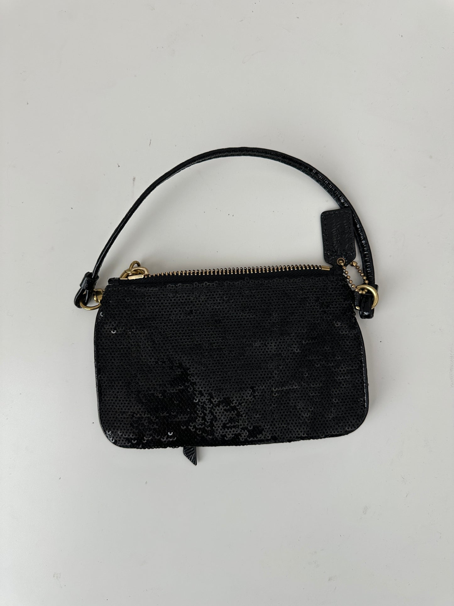 coach poppy sequin wristlet - black and gold