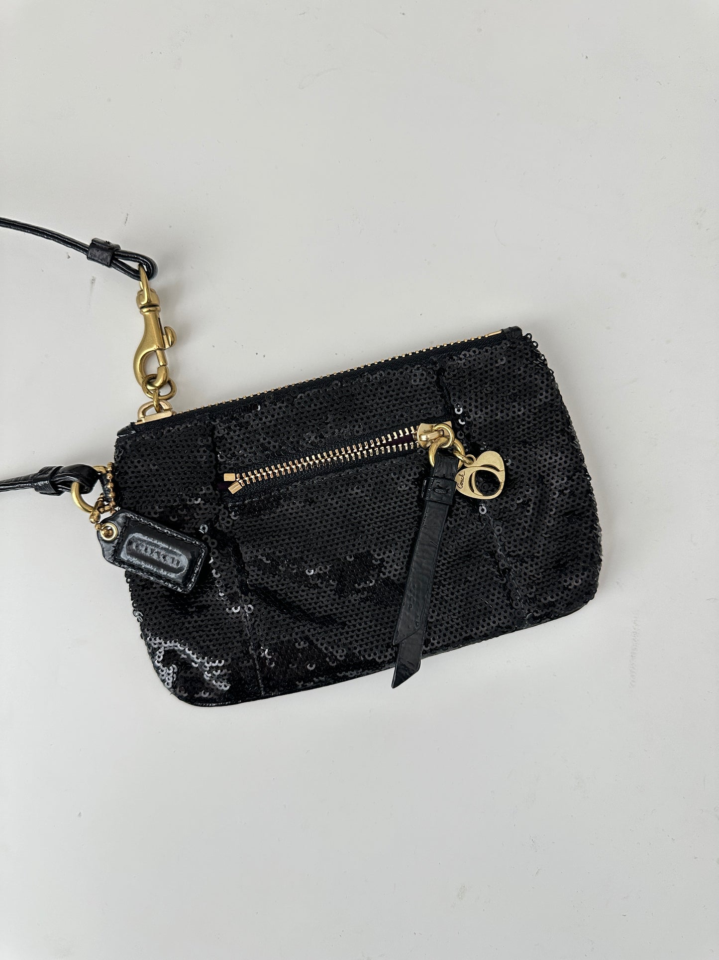 coach poppy sequin wristlet - black and gold