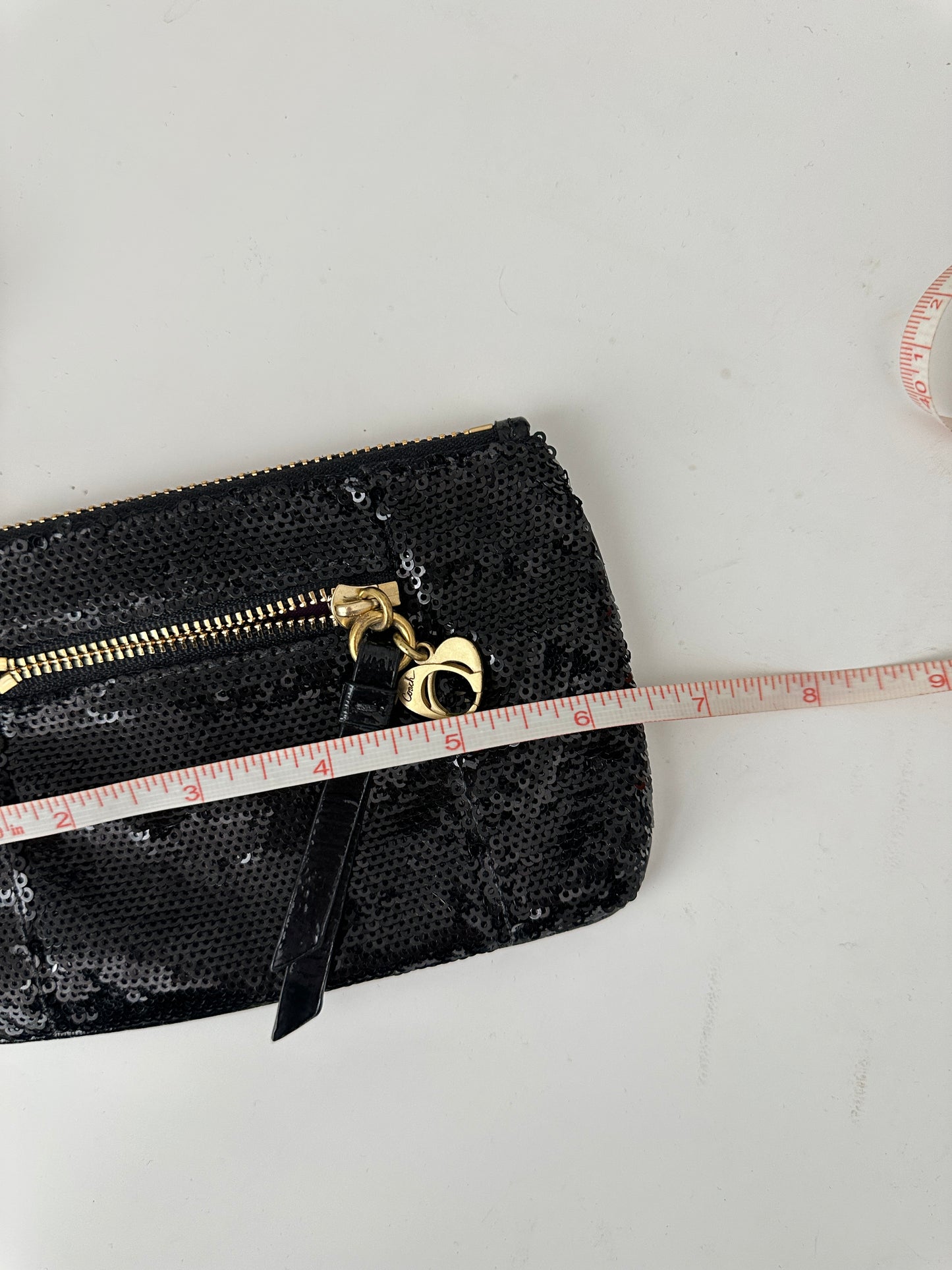 coach poppy sequin wristlet - black and gold