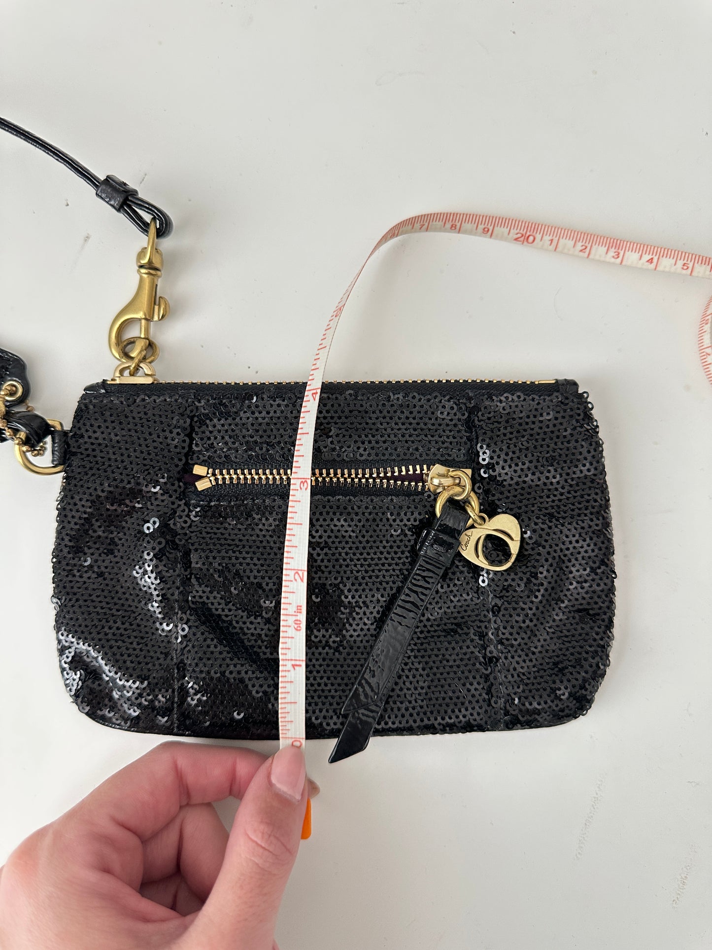 coach poppy sequin wristlet - black and gold